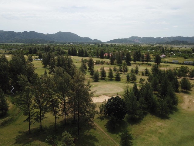 Lhoknga Golf Course fairway with Ulu Masen mountains